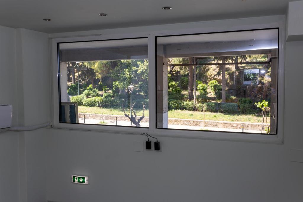 The loft window looking out onto the green park across the street